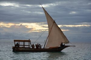 tourists are doing sunset dhow cruise